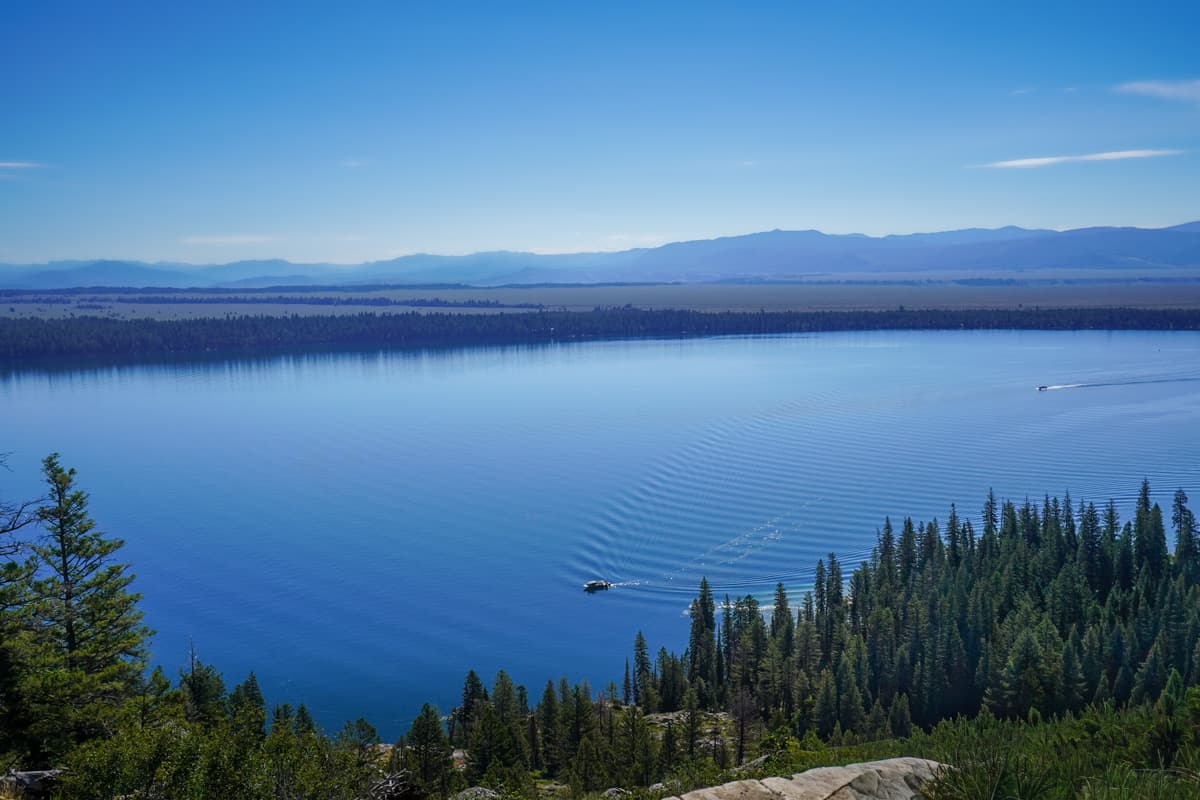 Boat shuttle crossing Jenny Lake from Inspiration Point in Grand Teton National Park in Wyoming