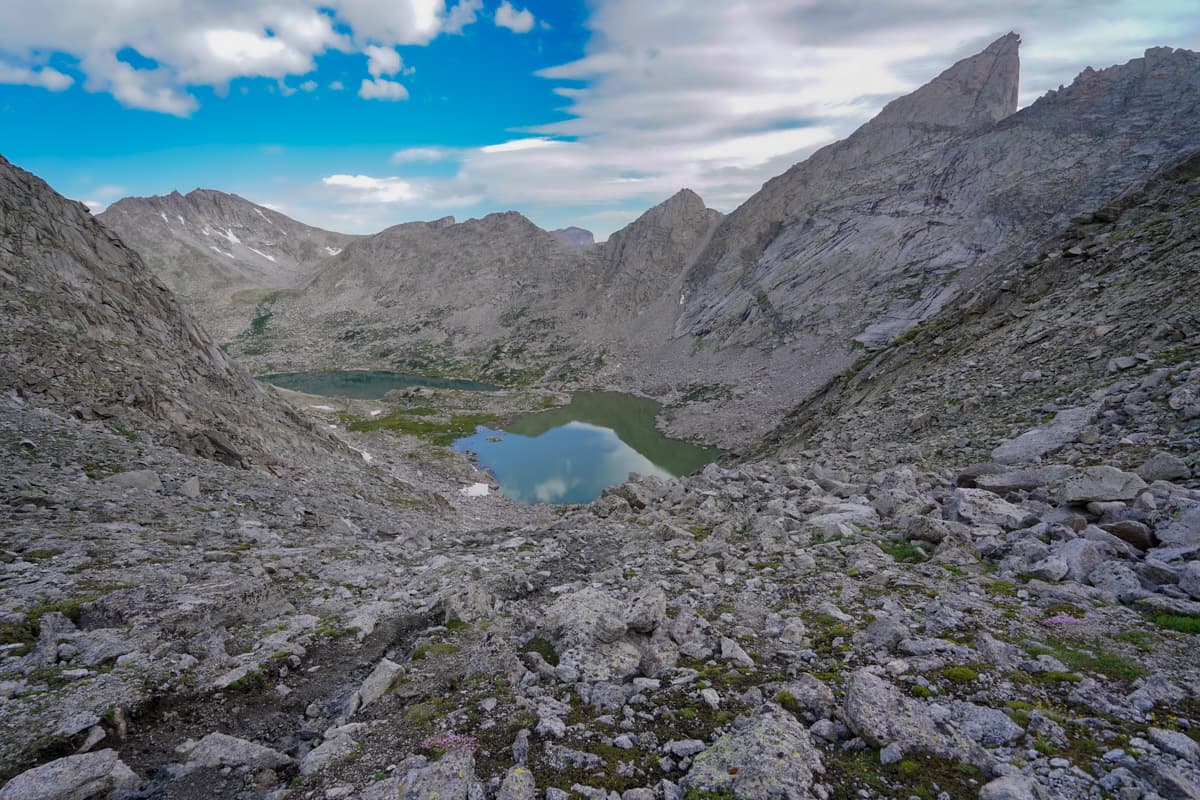 Scree along the slope of Texas Pass with Barren and Texas Lakes in the background along the Cirque of the Towers Trail in the Wind River range in Wyoming