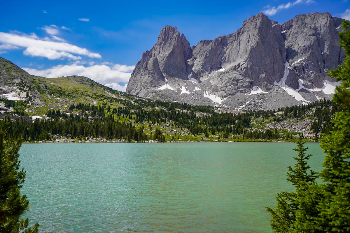 Mountains rising above Lonesome Lake along the Cirque of the Towers trail in the Wind River range in Wyoming