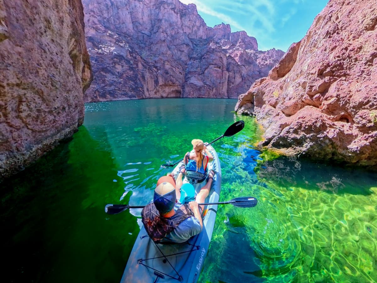 Couple sitting in a kayak in Emerald Cave in the Lake Mead National Recreation Area in Willow, Arizona