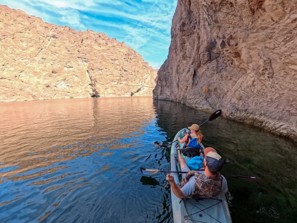 Couple kayakingin the Colorado River along the wall of Eco Cave in the Lake Mead National Recreation Area in Willow, Arizona