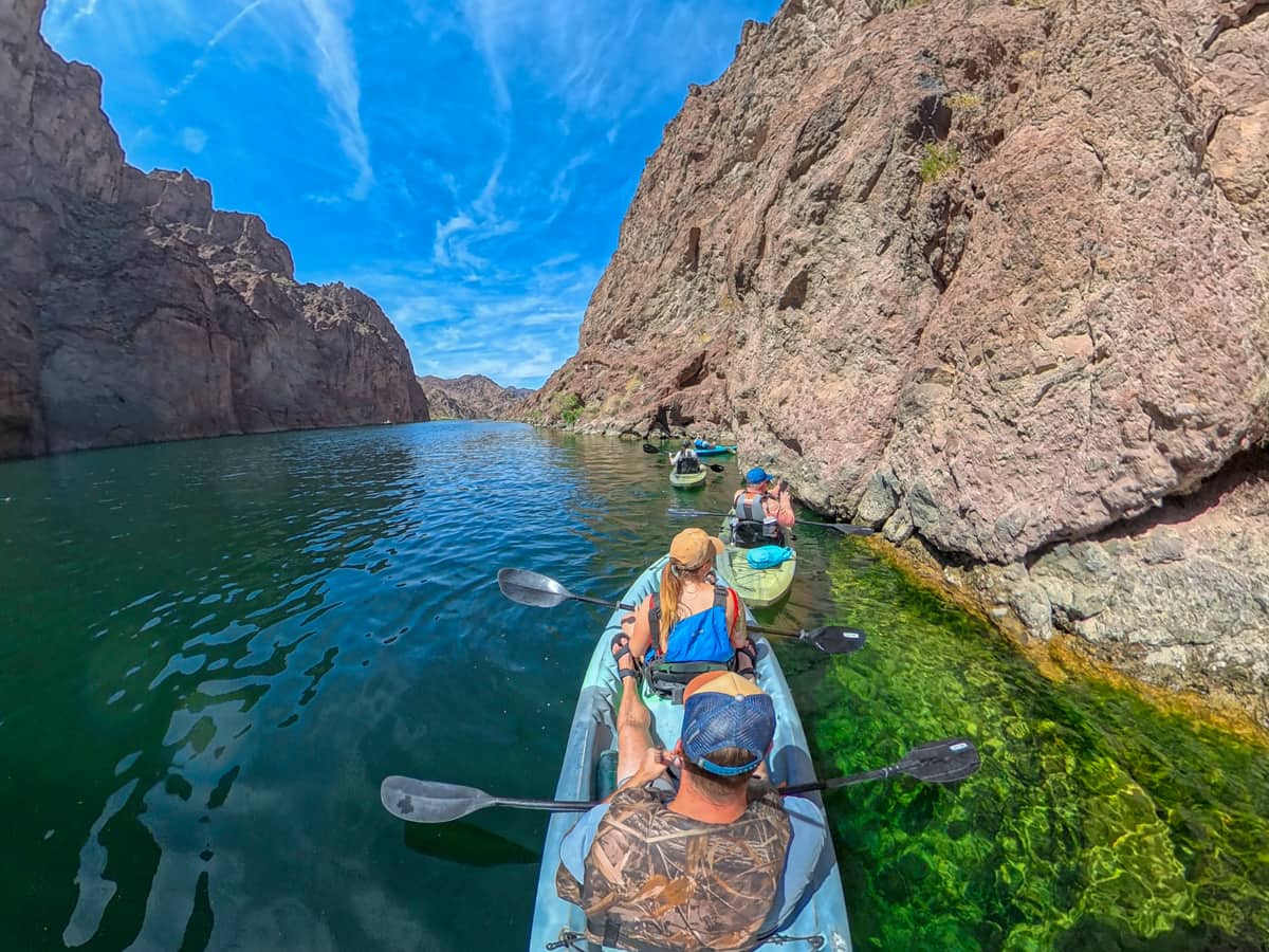 Kayakers waiting in line outside of the Emerald Cave in the Colorado River in the Lake Mead National Recreation Area in Willow, Arizona