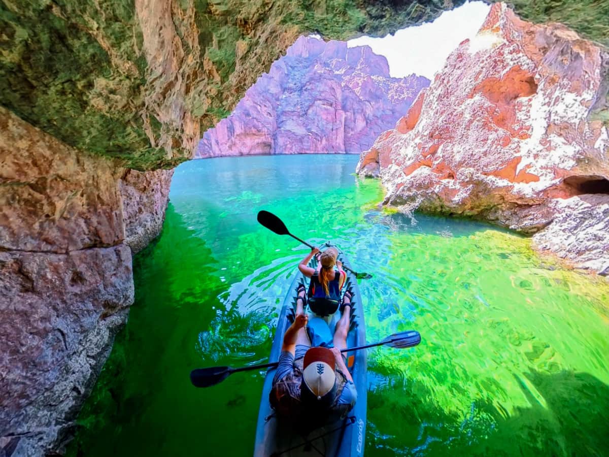 Couple kayaking in Emerald Cave in the Lake Mead National Recreational Area in Willow, Arizona