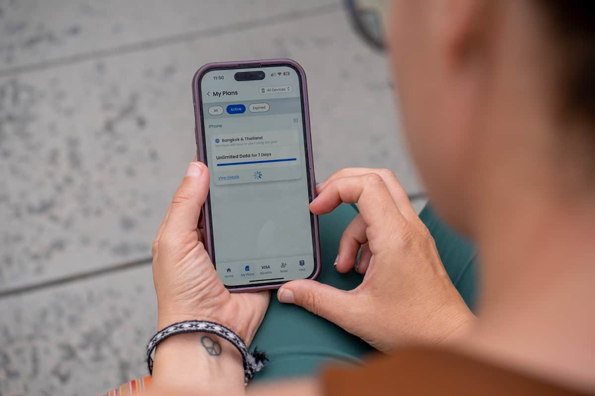 Woman looking at the available data for a free GigSky eSIM plan