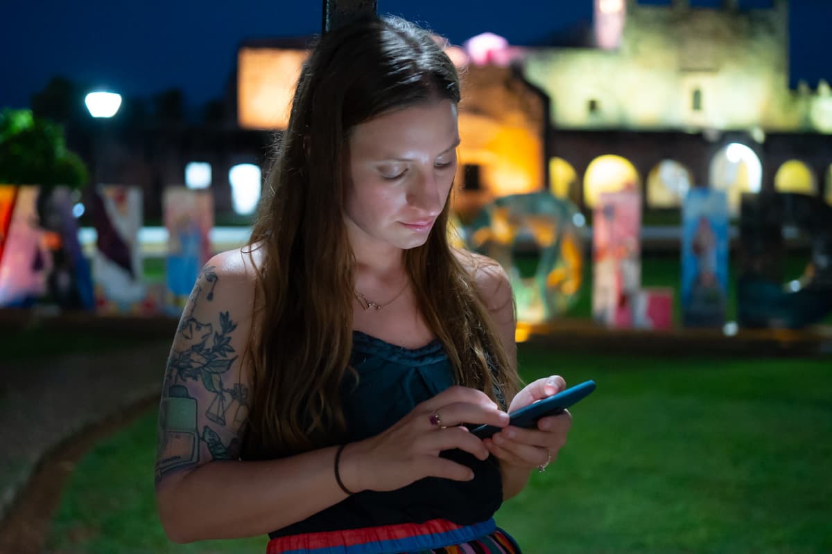 Woman looking at cell phone at Valladolid, Mexico