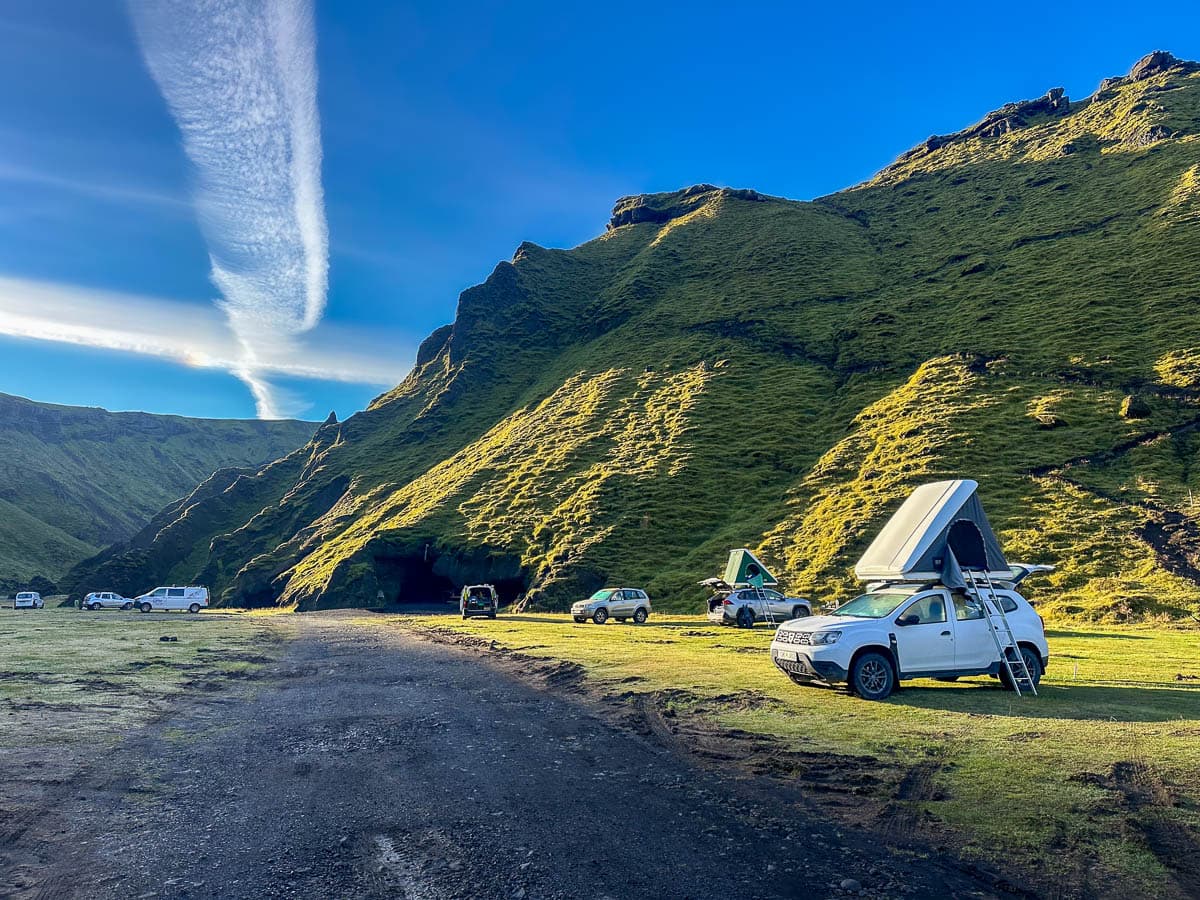 SUVs with rooftop tents parks at the Thakgil Campground in the Highlands of Iceland