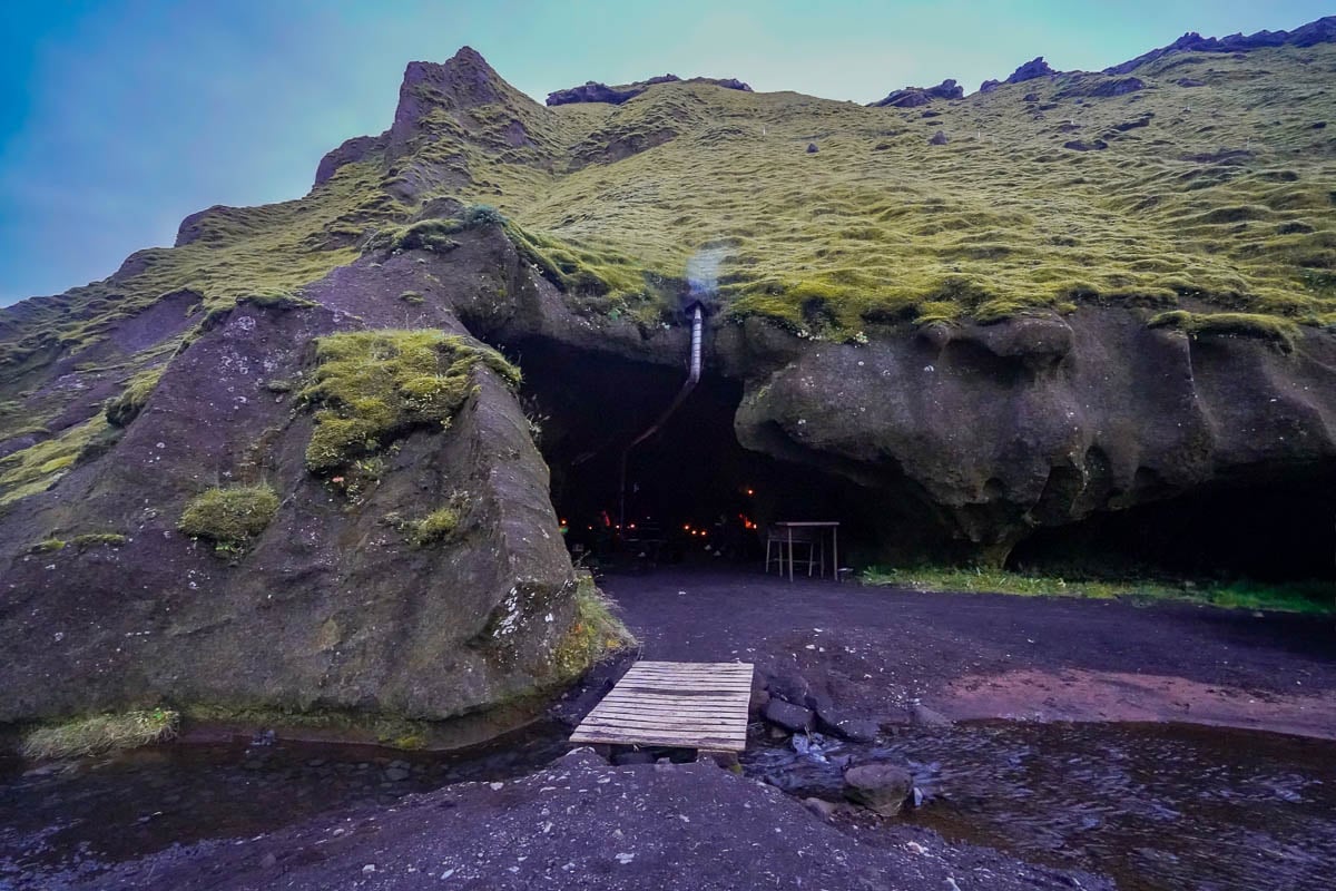 Dining and cooking in a mossy cave at Þakgil Campground in Iceland