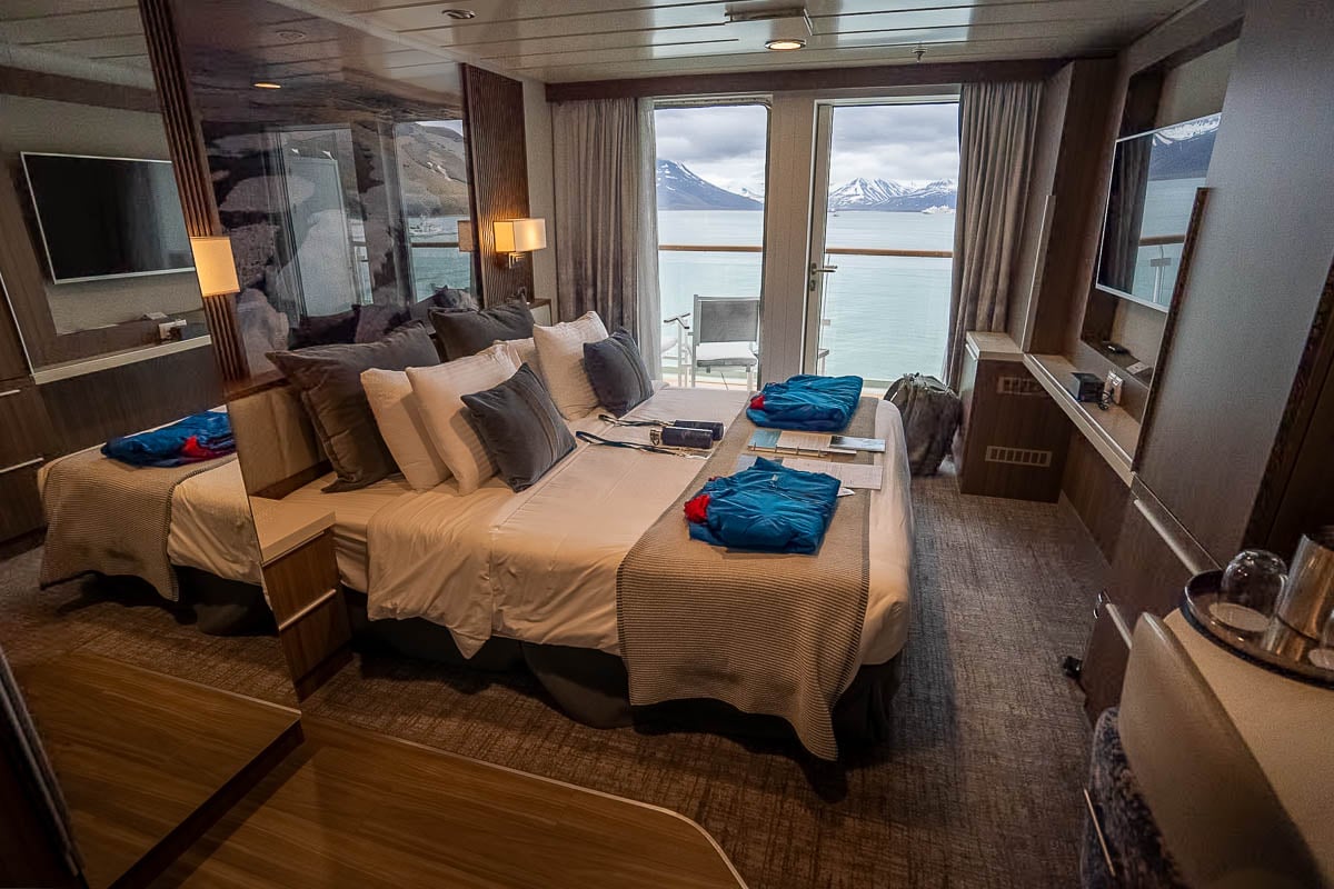Cabin with a balcony on the Aurora Expeditions Sylvia Earle cruise ship in Longyearbyen, Svalbard, Norway