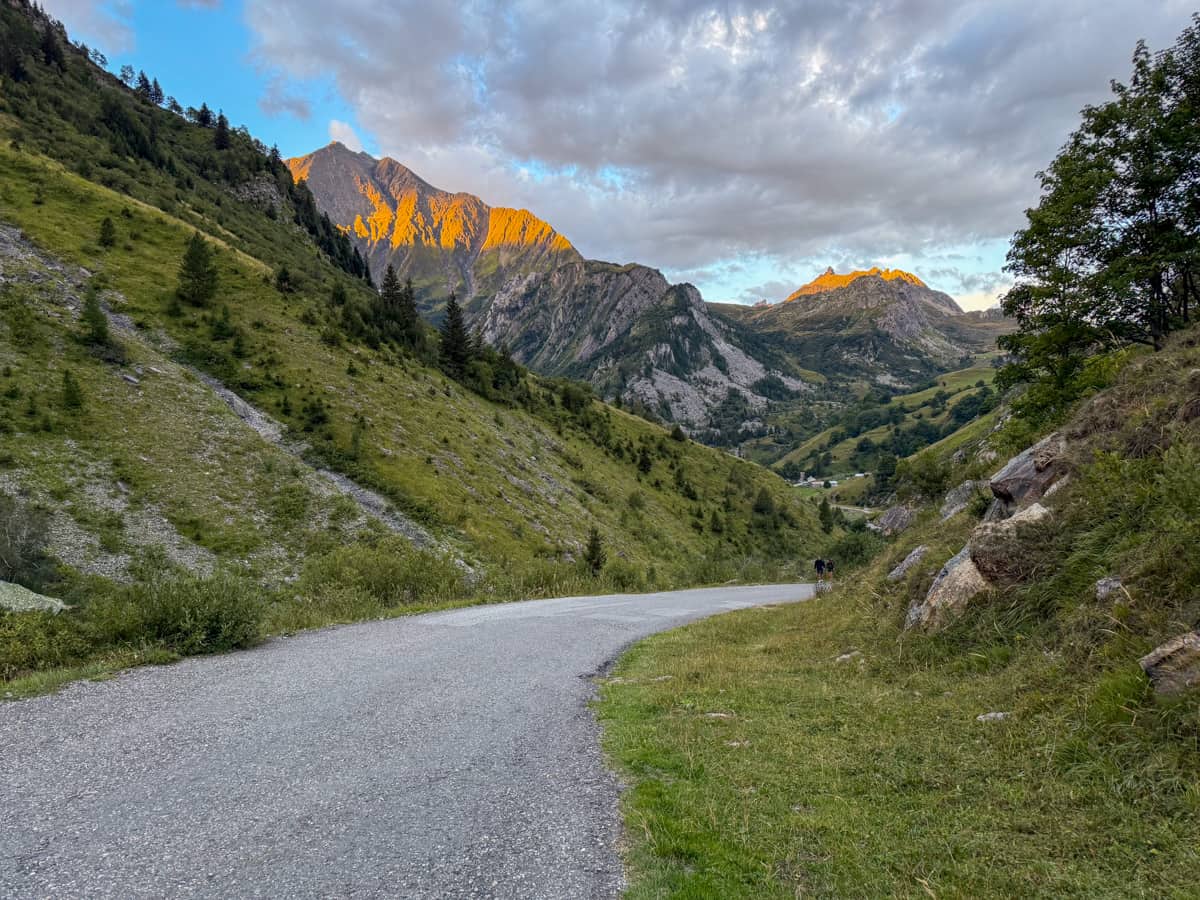 French Alps with alpine glow at sunrise near Les Chapieux, France along the Tour du Mont Blanc
