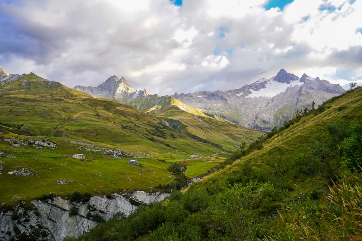 Green mountain slopes in the Vallée des Glaciers, France at sunrise along hte Tour du Mont Blanc