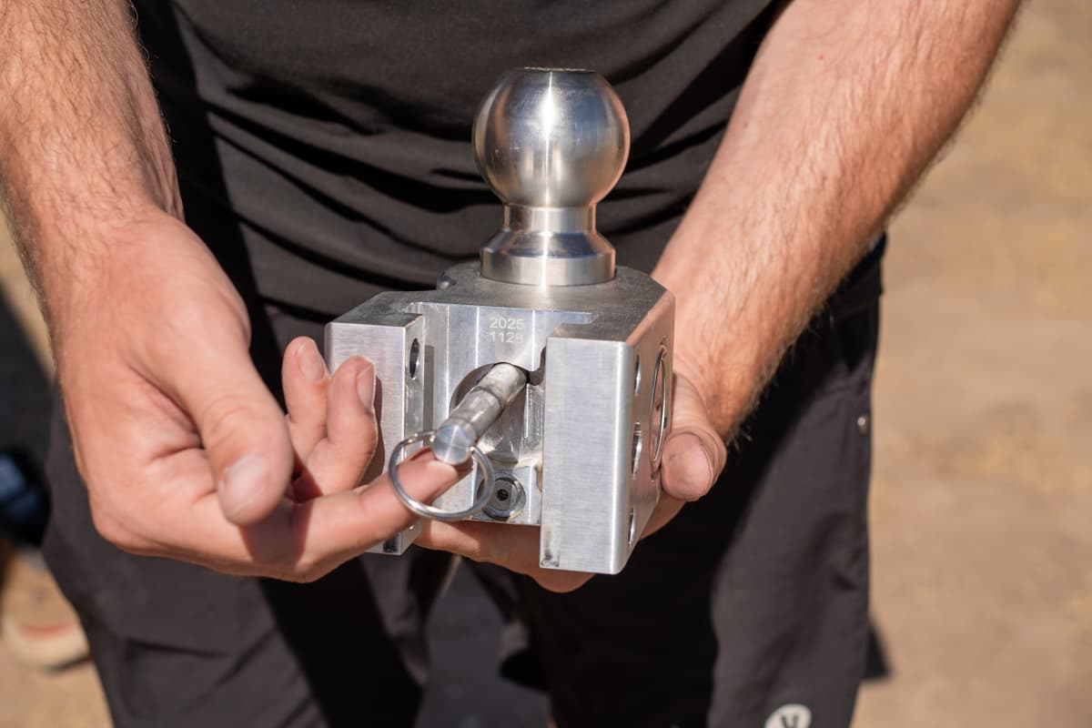 Man holding the pin for a hitch ball in a Weigh Safe ball mount