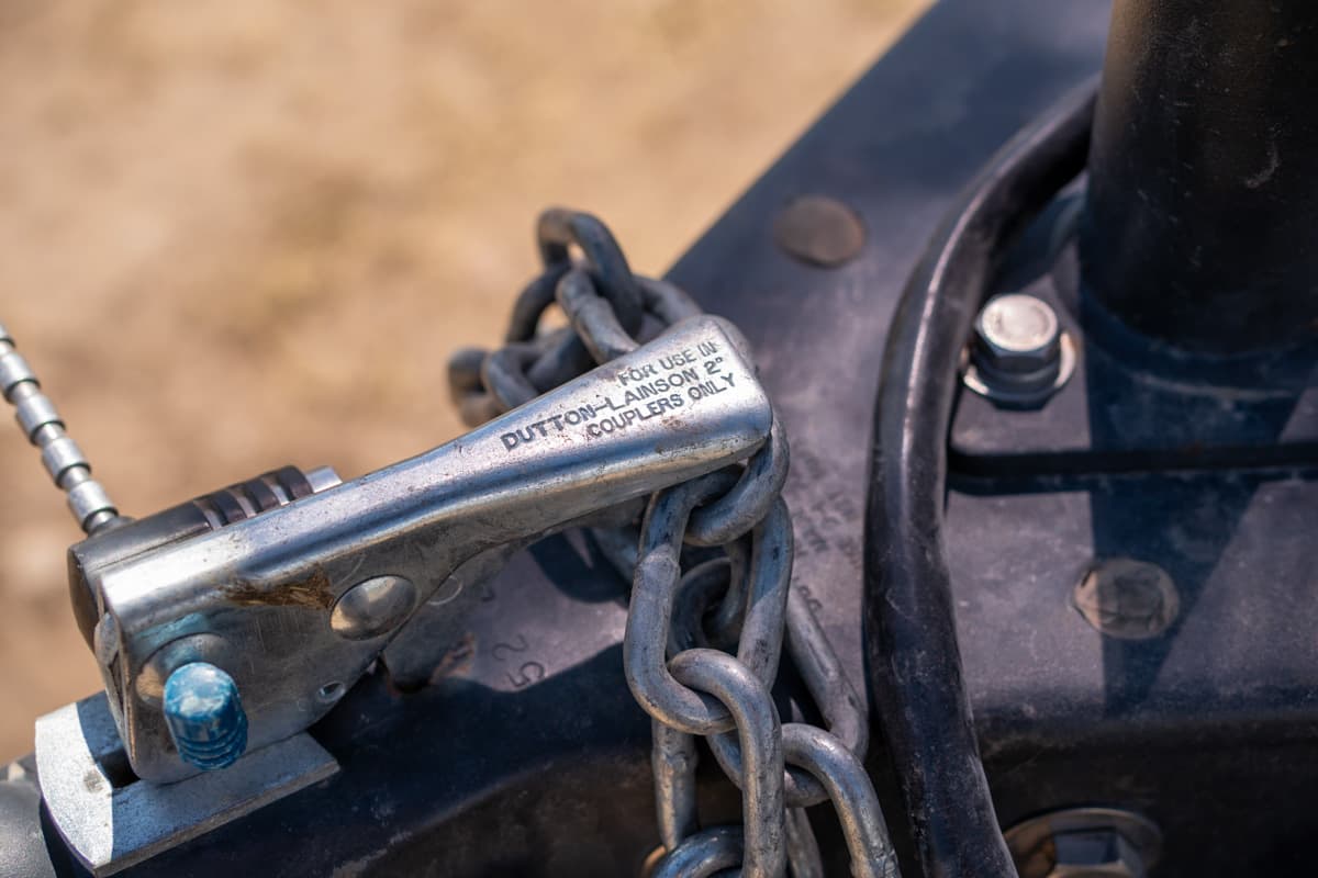 Close-up shot of hitch ball instructions stamped on a coupler of a Safari Condo Alto A1752 trailer