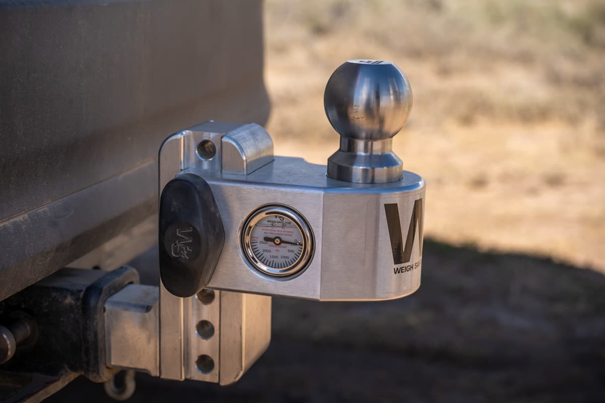 Trailer hitch ball mount installed on the back of a Highlander Hybrid SUV