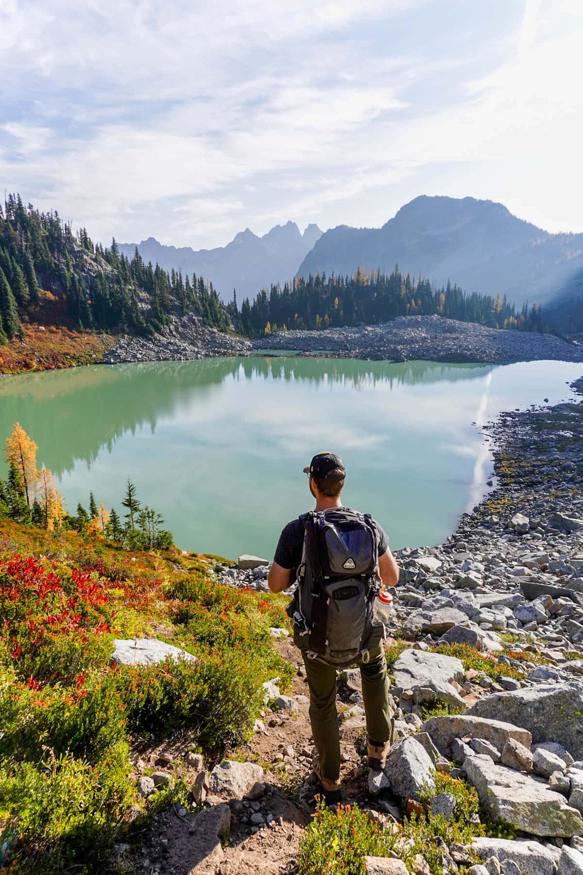 Man looking at Lewis Lake near Maple Pass Loop in North Cascades National Park in Washington