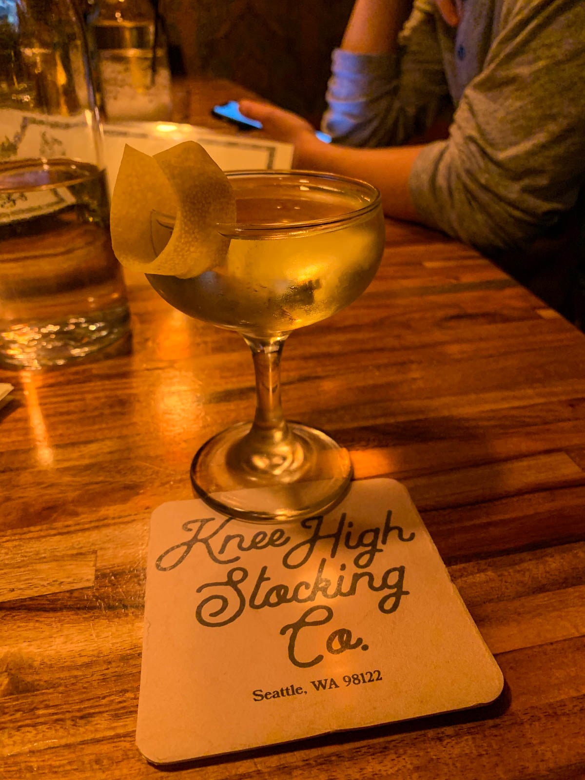 Cocktail on a coaster at Knee High Stocking Co. in Seattle, Washington